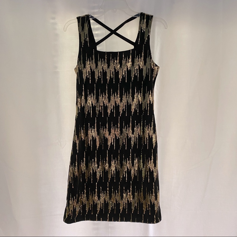 Black and gold sequin dress.